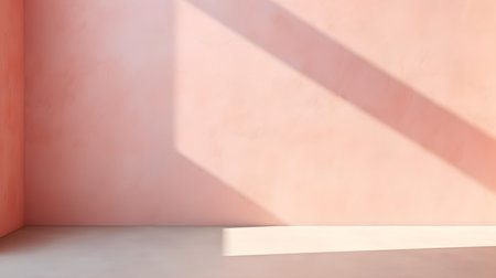 Empty Room in blush Colors with Shadows on the Wall. Elegant Studio Background for Product Presentation.の素材