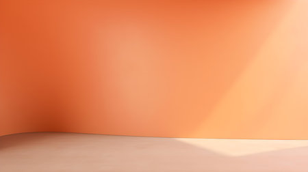 Empty room in light orange colors with shadows on the wall. Elegant Studio Background for Product Presentation.の素材