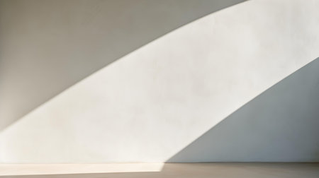 Empty room in white colors with shadows on the wall. Elegant Studio Background for Product Presentation.の素材