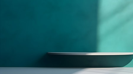 Empty Room in cyan Colors with Shadows on the Wall. Minimal podium for product presentation.の素材