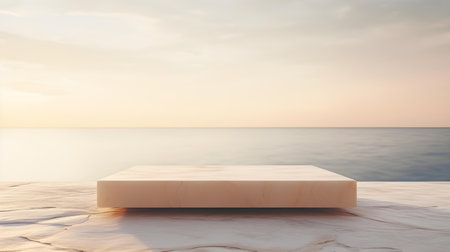 Square Marble Podium in beige Colors in front of a blurred Seascape. Luxury backdrop for product presentationの素材