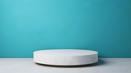 Round Stone Podium in front of a cyan Studio Background. White Pedestal for Product Presentationの素材