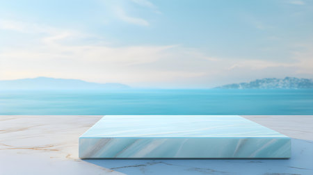 Square Marble Podium in cyan Colors in front of a blurred Seascape. Luxury backdrop for product presentationの素材