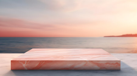 Square Marble Podium in light red Colors in front of a blurred Seascape. Luxury backdrop for product presentationの素材