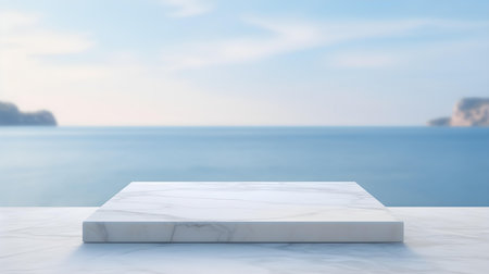 Square Marble Podium in light blue Colors in front of a blurred Seascape. Luxury backdrop for product presentationの素材