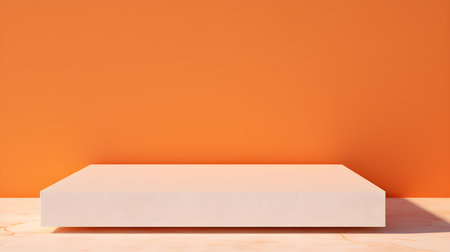 Square Stone Podium in front of an orange Studio Background. White Pedestal for Product Presentationの素材