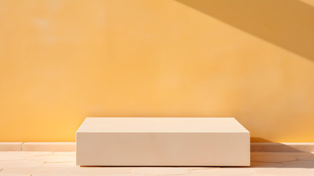 Square Stone Podium in front of a light yellow Studio Background. White Pedestal for Product Presentationの素材