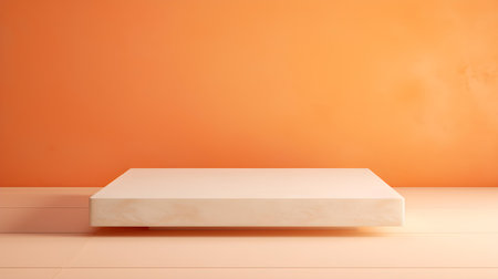 Square stone podium in front of a light orange studio background. White Pedestal for Product Presentationの素材