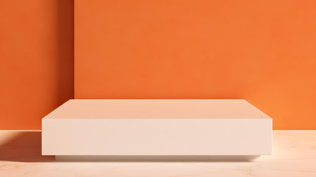Square Stone Podium in front of an orange Studio Background. White Pedestal for Product Presentationの素材