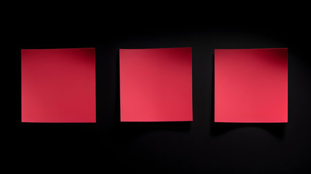 Set of ruby square paper notes on a black background. Brainstorming template with copy spaceの素材
