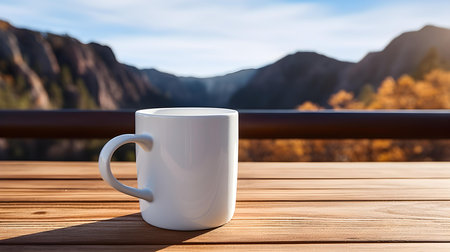 Close up of a white mug on a wooden table in the mountains. Blurred natural backgroundの素材