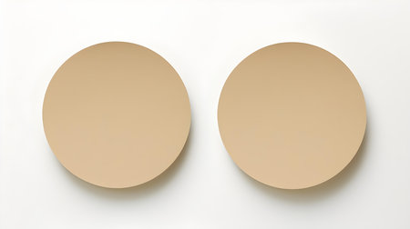 Two beige round paper notes on a white background. Brainstorming template with copy spaceの素材