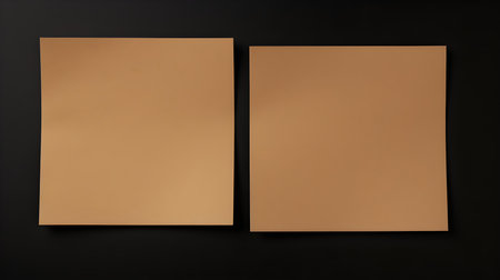 Two dark brown square paper notes on a black background. Brainstorming template with copy spaceの素材