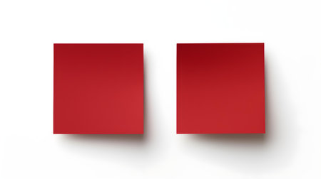 Two dark red square paper notes on a white background. Brainstorming template with copy spaceの素材