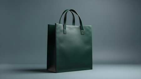 Dark Green Shopping Bag on a light Background with Copy Space. Template for sales and auctionsの素材