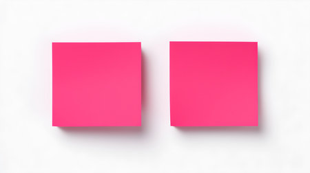 Two hot pink square paper notes on a white background. Brainstorming template with copy spaceの素材