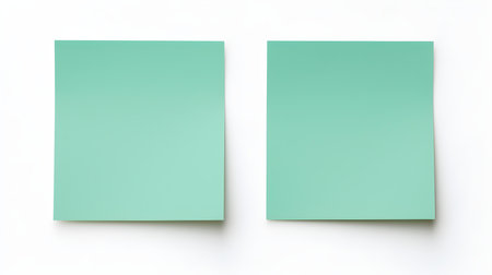 Two green square paper notes on a white background. Brainstorming template with copy spaceの素材
