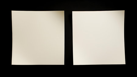 Two ivory square paper notes on a black background. Brainstorming template with copy spaceの素材