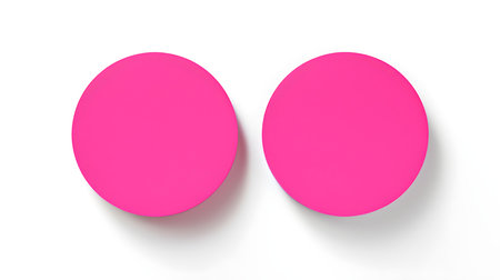 Two hot pink round paper notes on a white background. Brainstorming template with copy spaceの素材