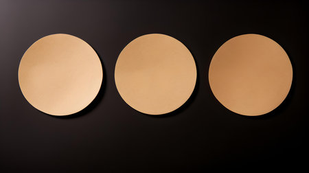 Set of light brown round paper notes on a black background. Brainstorming template with copy spaceの素材