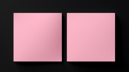 Two light pink square paper notes on a black background. Brainstorming template with copy spaceの素材