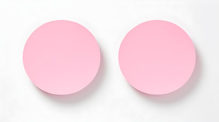 Two light pink round paper notes on a white background. Brainstorming template with copy spaceの素材