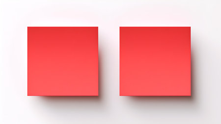 Two light red square paper notes on a white background. Brainstorming template with copy spaceの素材