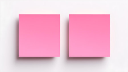 Two light pink square paper notes on a white background. Brainstorming template with copy spaceの素材