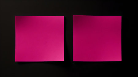 Two magenta square paper notes on a black background. Brainstorming template with copy spaceの素材