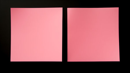 Two pink square paper notes on a black background. Brainstorming template with copy spaceの素材