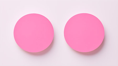 Two pink round paper notes on a white background. Brainstorming template with copy spaceの素材