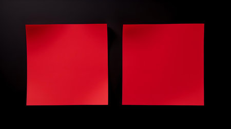 Two red square paper notes on a black background. Brainstorming template with copy spaceの素材