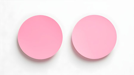 Two pink round paper notes on a white background. Brainstorming template with copy spaceの素材