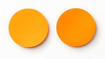 Two orange round paper notes on a white background. Brainstorming template with copy spaceの素材