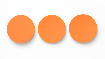 Set of orange round paper notes on a white background. Brainstorming template with copy spaceの素材