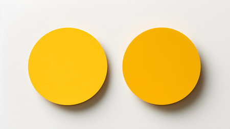 Two yellow round paper notes on a white background. Brainstorming template with copy spaceの素材