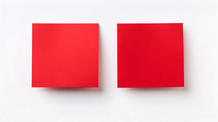 Two red square paper notes on a white background. Brainstorming template with copy spaceの素材
