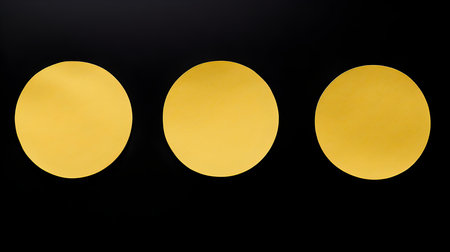 Set of yellow round paper notes on a black background. Brainstorming template with copy spaceの素材