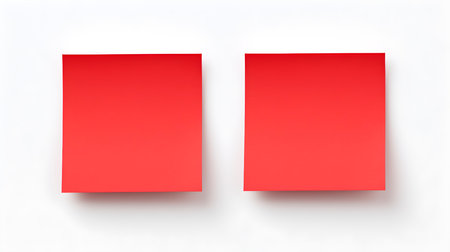 Two red square paper notes on a white background. Brainstorming template with copy spaceの素材