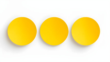 Set of yellow round paper notes on a white background. Brainstorming template with copy spaceの素材