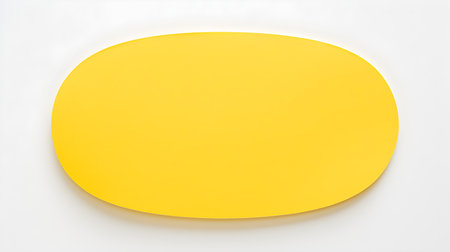 Yellow oval paper note on a white background. Brainstorming template with copy spaceの素材