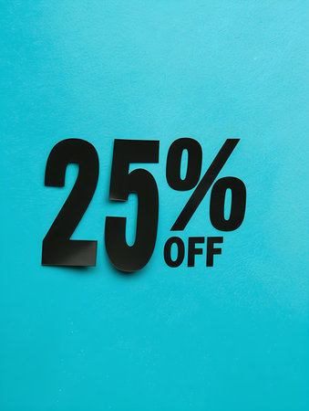 Black '25% OFF' Promotional Sign on a Turquoise Backgroundの素材