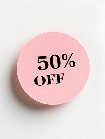 Black '50% OFF' Text on a Blush Round Paper Note. White Backgroundの素材