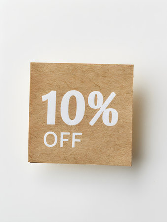 White '10% OFF' Text on a Light Brown Square Paper Note. White Backgroundの素材