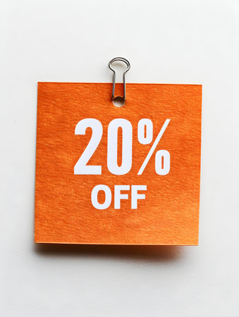 White '20% OFF' Text on an Orange Square Paper Note. White Backgroundの素材