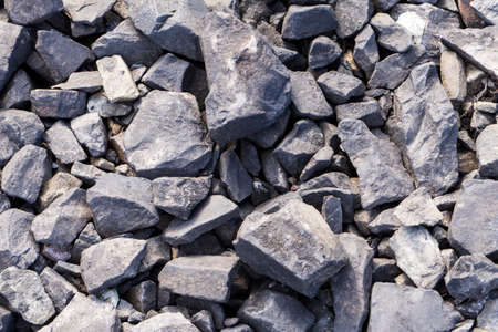 Pile of gray crushed stone as background texture. Close up.
