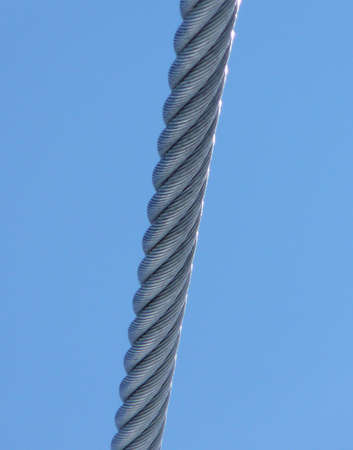 Metal cable and blue skyの写真素材