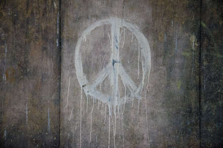Peace symbol painted on grunge wallの写真素材