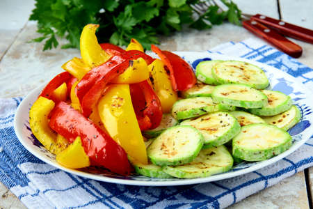 grilled vegetables - zucchini, pepper paprika on a plateの写真素材