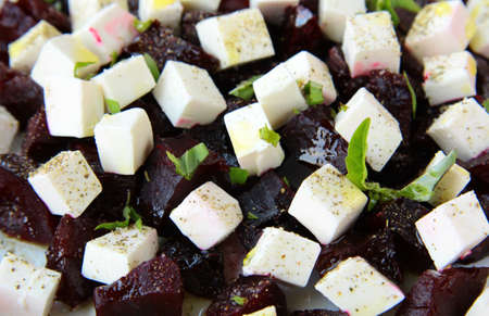 appetizer salad of beets and goat cheese with basil